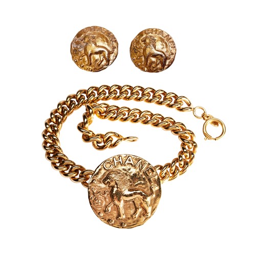 64 - CHANEL; A GILT NECKLACE LATE 1980'S,  FROM THE ZODIAC COLLECTION, NUMBER 23 the circular plaque depi... 