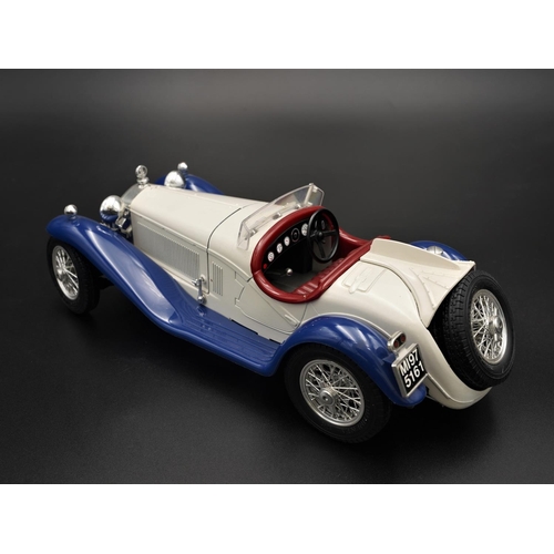 256 - 1932 ALFA-ROMEO 2300 SPIDER IN WHITE/BLUE BY BBURAGO  Diecast metal with plastic components.