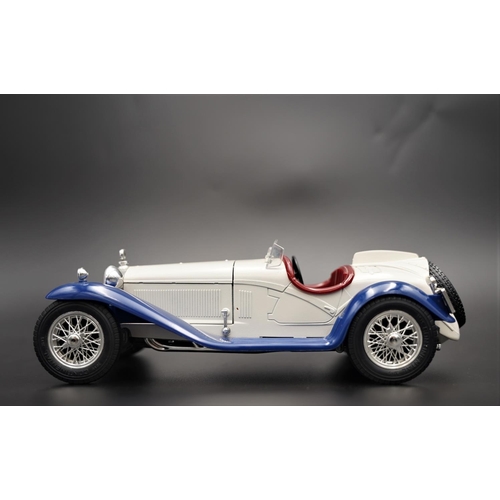 256 - 1932 ALFA-ROMEO 2300 SPIDER IN WHITE/BLUE BY BBURAGO  Diecast metal with plastic components.