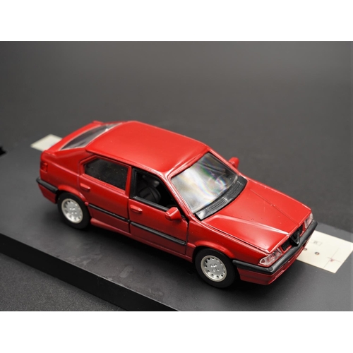 329 - ALFA-ROMEO 33 IN RED BY ALFA-ROMEO SCALE MODELS  Diecast metal with plastic components.