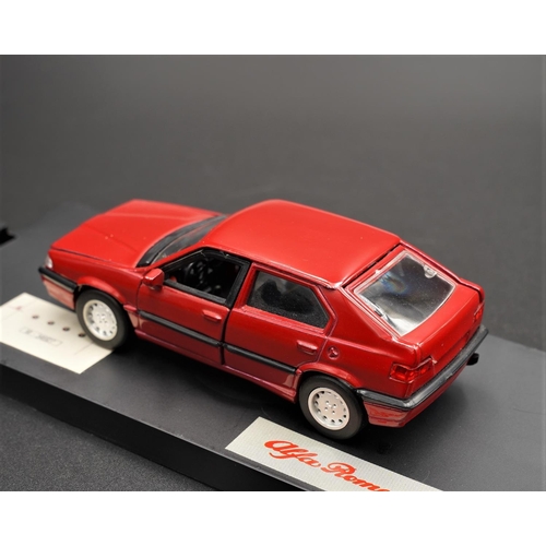 329 - ALFA-ROMEO 33 IN RED BY ALFA-ROMEO SCALE MODELS  Diecast metal with plastic components.