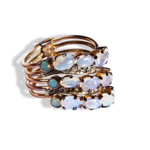 206 - A FIVE BAND OPAL RING five asymmetric undulating bands, three set with five opals each and two set w... 