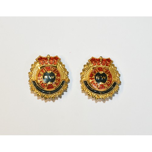 217 - A PAIR OF BUTLER AND WILSON MILITARY STYLE CLIP EARRINGSwith BUTLER AND WILSON, BW in raised letteri... 