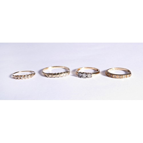 223 - FOUR DIAMOND DRESS RINGSOne three stone, illusion set, diamond ring with pierced gallery to a taperi... 