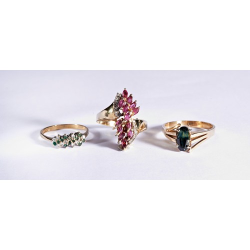 229 - THREE GEM SET DRESS RINGSA claw set green and white stone cluster ring, with pierced gallery to a ta... 