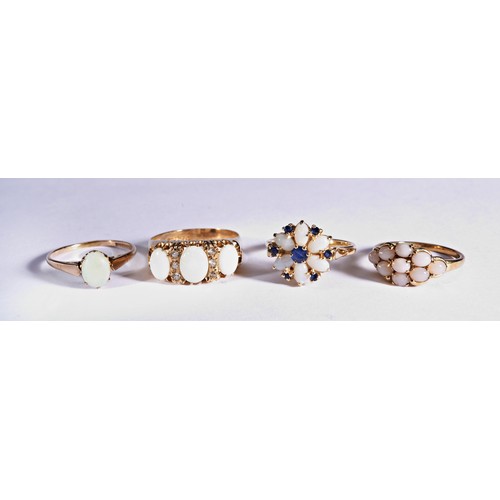 237 - FOUR STONE SET DRESS RINGSA Victorian style ring, claw set with three oval opal cabochons accented b... 