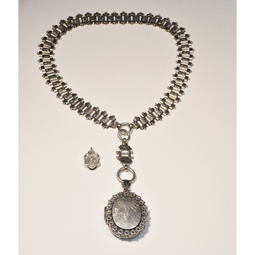 200 - LATE VICTORIAN SILVER PENDANTS AND NECKLACEA locket pendant with engraved design on a chatelain fobL... 