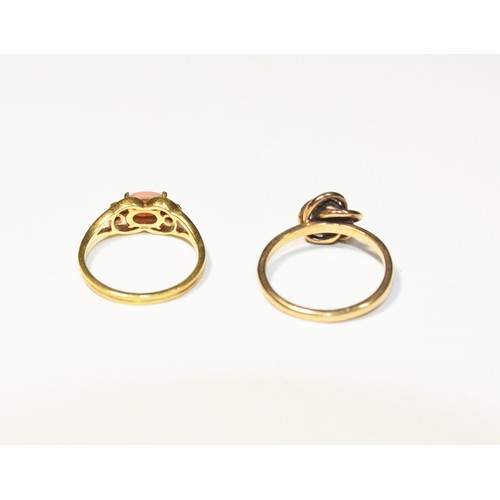 260 - TWO DIAMOND SET GOLD RINGS, CIRCA 1890A gold ring set with a coral cabochon and two round cut diamon... 