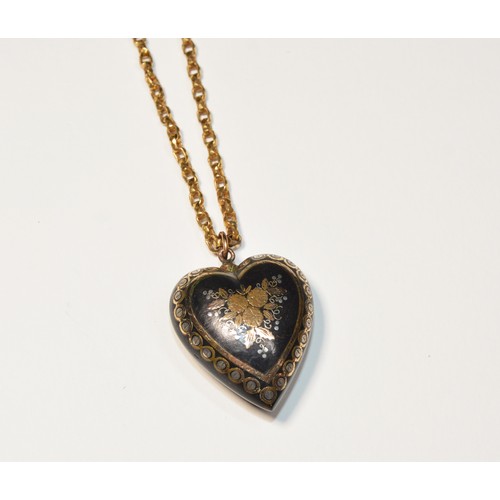 263 - A PIQUE HEART PENDANT NECKLACE a tortoiseshell heart in laid with gold and silver floral design on a... 