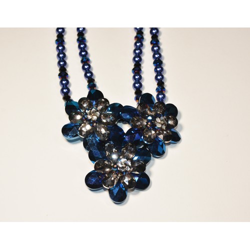 279 - A COLLECTION OF BUTLER & WILSON JEWELLERY A blue crystal flower necklace.Length 56cmWeight 130gm... 