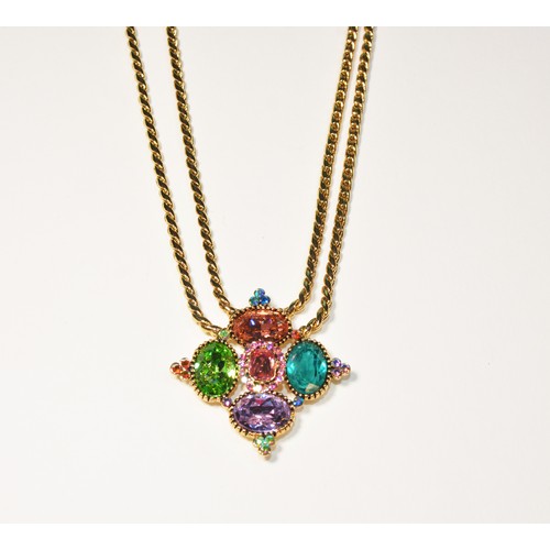 281 - A BUTLER AND WILSON NECKLACEthe central multi coloured crystal cruciform pendant on two gold coloure... 