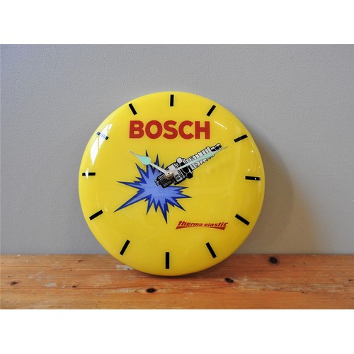 119 - BOSCH BRANDED PROMOTIONAL WALL CLOCKc. 1980s, in plastic, yellow with black baton hour markers and B... 
