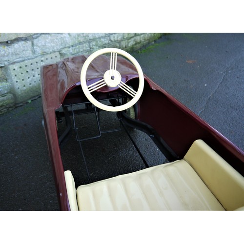 75 - 1950s PEDAL CAR, FRENCHFinished in maroon, subject to previous restoration and overall presents well... 