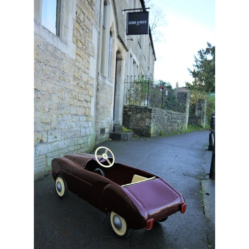 75 - 1950s PEDAL CAR, FRENCHFinished in maroon, subject to previous restoration and overall presents well... 