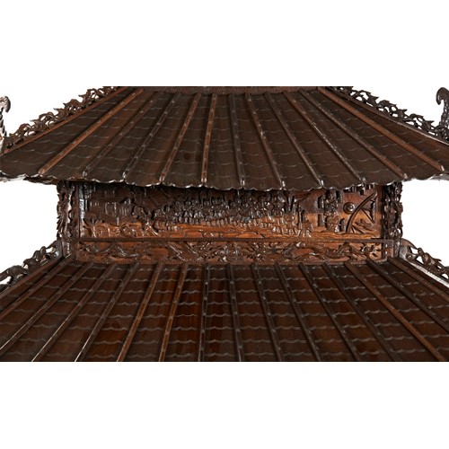 132 - IMPRESSIVE CARVED HARDWOOD 'PAGODA' FORM CABINETQING DYNASTY, 19TH CENTURYthe double-tiered pagoda-f... 