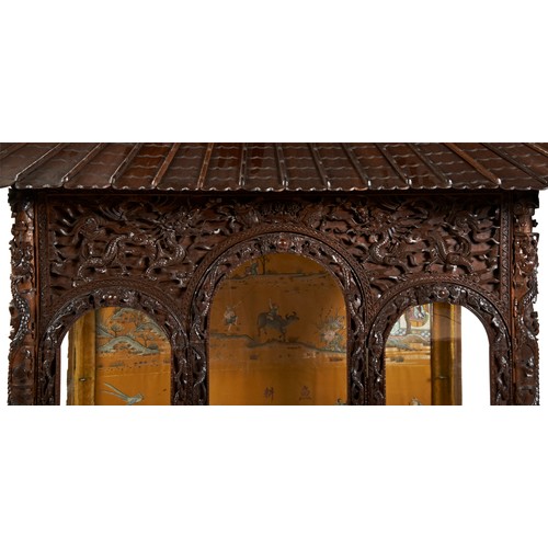 132 - IMPRESSIVE CARVED HARDWOOD 'PAGODA' FORM CABINETQING DYNASTY, 19TH CENTURYthe double-tiered pagoda-f... 