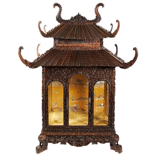 132 - IMPRESSIVE CARVED HARDWOOD 'PAGODA' FORM CABINETQING DYNASTY, 19TH CENTURYthe double-tiered pagoda-f... 