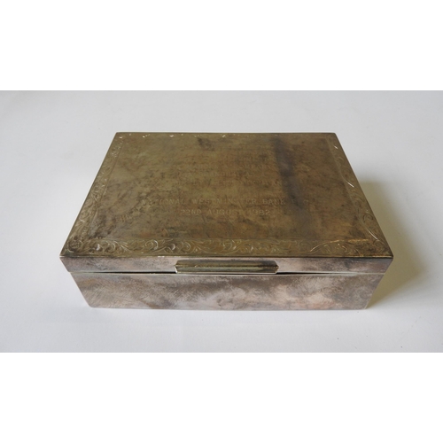 506 - A SILVER ENCASED CIGARETTE BOX, mark of Charles Green, Birmingham, 1975, with chased scroll foliate ... 