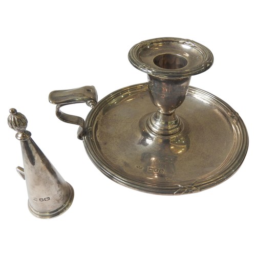 522 - A SILVER CHAMBERSTICK, with fluted cross hatch border decoration, scroll work handle, and a conical ... 