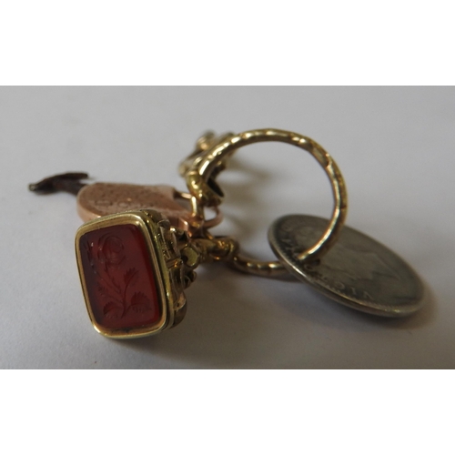 450 - A 19TH CENTURY GOLD CASED CARNELIAN FOB, GOLD CASED MINIATURE BUTTON HOOK, GOLD CASED WATCH KEY AND ... 