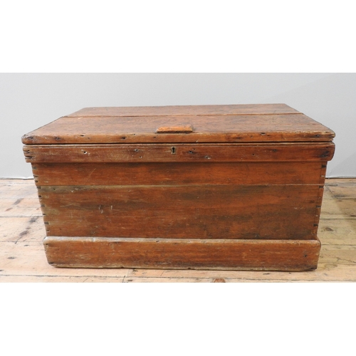 25 - A 19TH CENTURY PINE BLANKET BOX, of simple rustic form, constructed from dove tailed panels, with ir... 