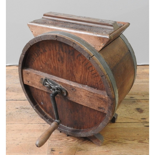 140 - A 19TH CENTURY COOPERED BUTTER CHURN, with detachable cast-iron handle, 42 cm diameter