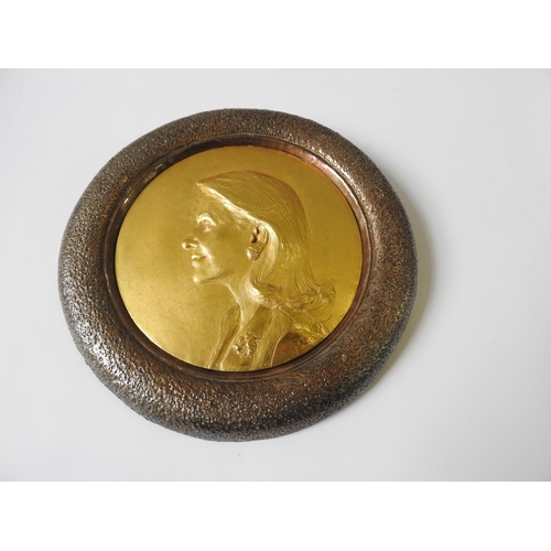 330 - RAPHAEL CINDONCHA (b.1952) GILT BRONZE PORTRAIT RELIEF PANEL, mounted in a circular hammered bronze ... 