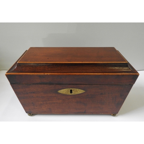 424 - A REGENCY MAHOGANY TEA CADDY, of tapered sarcophagus form with inlaid edging, the lid opens to revea... 