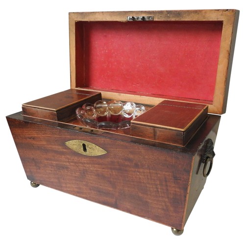 424 - A REGENCY MAHOGANY TEA CADDY, of tapered sarcophagus form with inlaid edging, the lid opens to revea... 