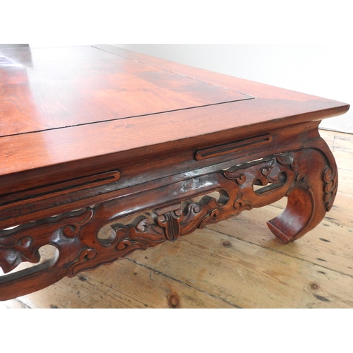 124 - A CHINESE HARDWOOD LOW TABLE, with pierced carved frieze, 30 x 150 x 70 cm