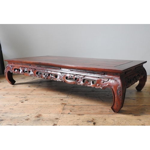 124 - A CHINESE HARDWOOD LOW TABLE, with pierced carved frieze, 30 x 150 x 70 cm