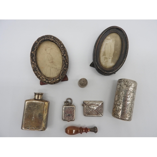 472 - TWO OVAL SILVER PICTURE FRAMES, SILVER SCENT FLASK, SILVER CASED SCENT BOTTLE AND TRINKETS, the trin... 