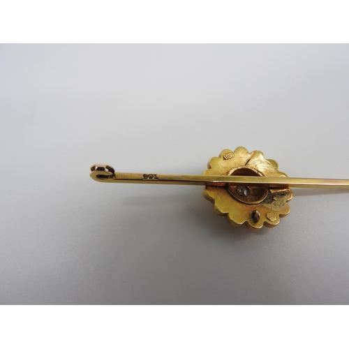 455 - A LATE 19TH CENTURY GOLD ETRUSCAN REVIVAL BROOCH, with a single star set diamond in the centre of a ... 