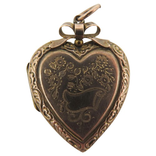 447 - A 19TH CENTURY GOLD FILLED SWEETHEART LOCKET, by Sydenham Bros, engraved decoration depicting bird a... 