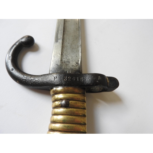 283 - A FRENCH 19TH CENTURY CHASSEPOT BAYONET, with brass grip and steel hilt and scabbard, both stamped P... 