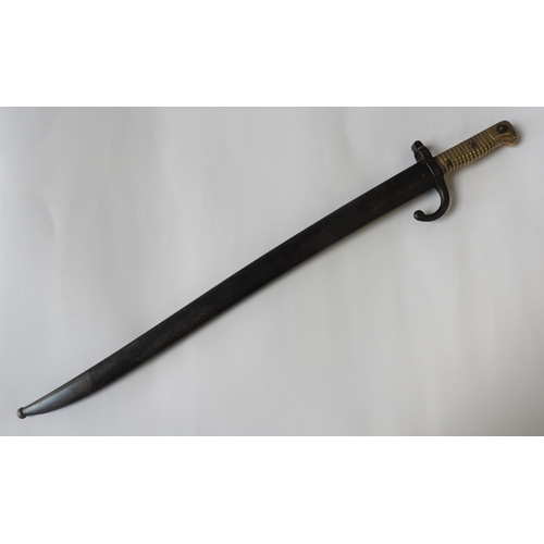 283 - A FRENCH 19TH CENTURY CHASSEPOT BAYONET, with brass grip and steel hilt and scabbard, both stamped P... 