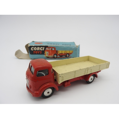 292 - A CORGI TOYS 452 COMMER 5 TON DROPSIDE LORRY, boxed (in damaged box), along with a Dinky Toy wheel b... 