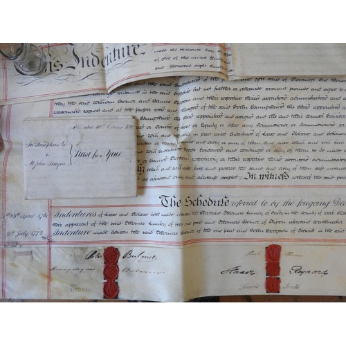 268 - A COLLECTION OF SEVENTEEN 19TH CENTURY INDENTURES ON VELUM, along with a cast bronze opium weight, n... 