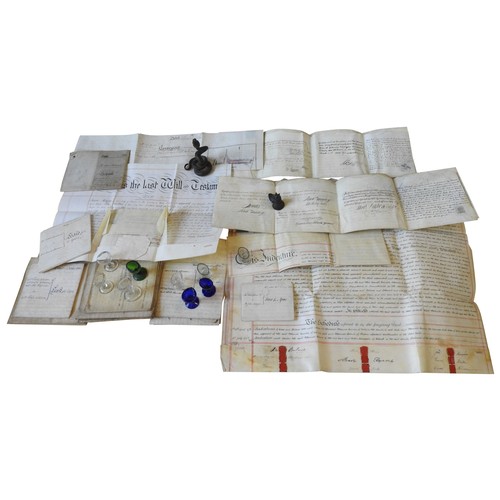 268 - A COLLECTION OF SEVENTEEN 19TH CENTURY INDENTURES ON VELUM, along with a cast bronze opium weight, n... 