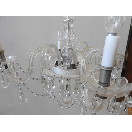 151 - A LARGE GLASS CHANDELIER, comprised of four down swept spiral twist branches with glass drip trays a... 