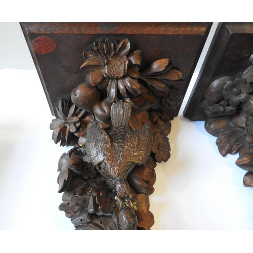 72 - A PAIR OF 19TH CENTURY CARVED FRUITWOOD CORBELS, each depicting two birds amongst a cornucopia of fr... 