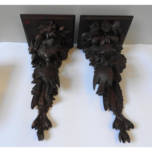 72 - A PAIR OF 19TH CENTURY CARVED FRUITWOOD CORBELS, each depicting two birds amongst a cornucopia of fr... 