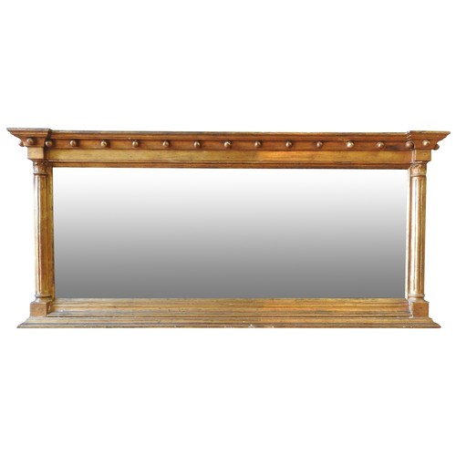 337 - A 19TH CENTURY GILT FRAMED OVERMANTEL MIRROR, ball frieze flanked by corinthian pillars, 58 x 130 cm