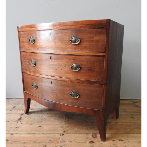 4 - A GEORGE III MAHOGANY BOW FRONT CHEST OF DRAWERS, comprising of three graduated long drawers, on spl... 