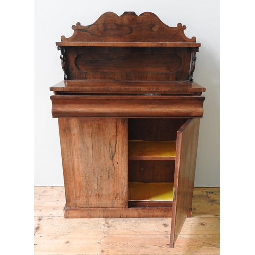 42 - A VICTORIAN ROSEWOOD CHIFFONIER, a fret cut gallery back with upper shelf with scroll supports, one ... 