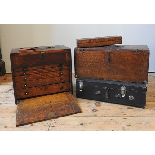 147 - A VINTAGE OAK TOOLMAKER'S CHEST, with five graduated drawers and lift-top, the chest full with vario... 