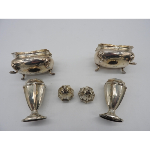 509 - A PAIR OF SILVER SALT & PEPPER CASTERS AND A PAIR OF SILVER SALT CELLARS, the casters bear the m... 