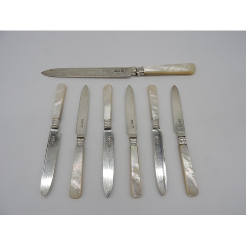 502 - SIX SILVER DESSERT KNIVES AND A CAKE KNIFE, all with mother of pearl handles, the cake knife with br... 