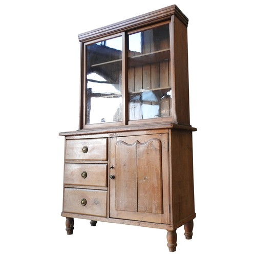 6 - A PINE BOOKCASE ON 19TH CENTURY CONTINENTAL PINE CUPBOARD, the bookcase with two glazed sliding door... 