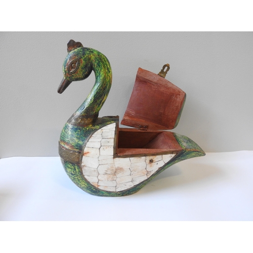 427 - A PAINTED HARDWOOD TRINKET BOX IN THE FORM OF A SWAN, with gilt metal mounts, the wings inset with b... 